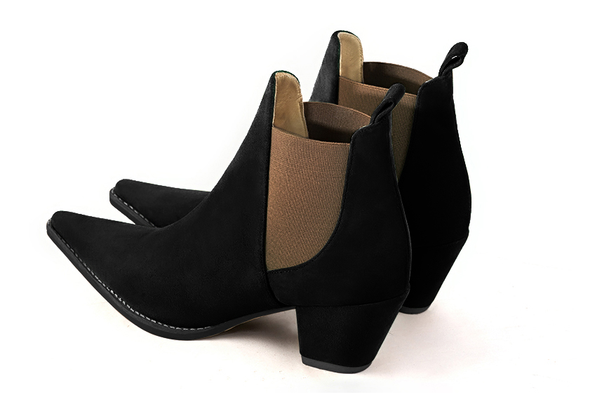 French elegance and refinement for these matt black and taupe brown dress booties, with elastics on the sides, 
                available in many subtle leather and colour combinations. This pretty bootie will do you a lot of good throughout the seasons.
Easy to put on with its elastic bands, it has everything to seduce you.
For the fans of very sharp models like "santiag..." 
Personalize it or not, with your colours on the page "My favorites".  
                Matching clutches for parties, ceremonies and weddings.   
                You can customize these ankle boots with elastics to perfectly match your tastes or needs, and have a unique model.  
                Choice of leathers, colours, knots and heels. 
                Wide range of materials and shades carefully chosen.  
                Rich collection of flat, low, mid and high heels.  
                Small and large shoe sizes - Florence KOOIJMAN